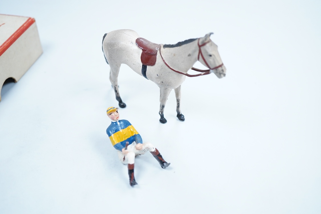 Two boxed Britains Racing Colours of Famous Owners series lead mounted figures; Miss Dorothy Paget - rider in yellow-striped blue jersey on a grey horse, and Msr. M. Boussac - rider in orange jersey on a dark brown horse